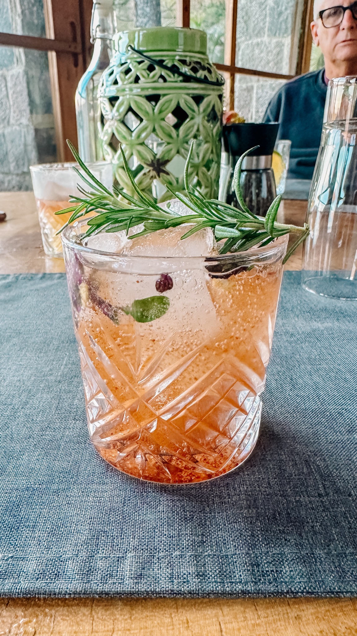 Cocktail with rosemary garnish
